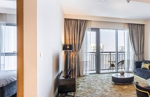Jadaf Apartment | MyDuomo: 1BR on high floor, with park & water views