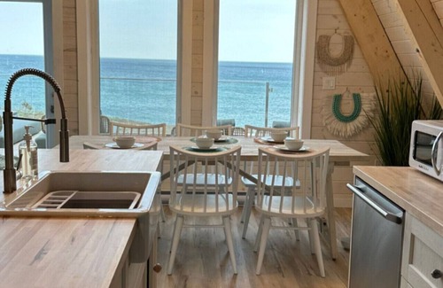 Aspy Bay House | Mystical Beachfront Chalet , Hot tub , Sauna and Heated Container Pool