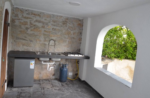 Praelo House | Natural stone house in panoramic position with pool and garden.