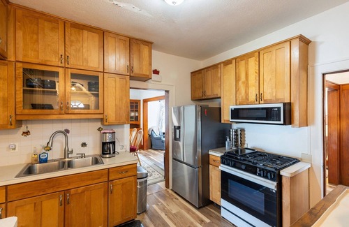 Garfield Heights House | NEW! Cozy Getaway with Hot Tub, Patio & Fenced Yard