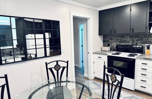 Grawn Cottage | New ~ Enchanting modern cottage tucked away in the trees. Heavenly Kingsize Bed.