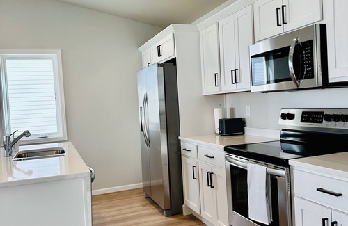 Fargo House | NEW family- friendly 3 bedrm home in West Fargo with space to gather and relax.