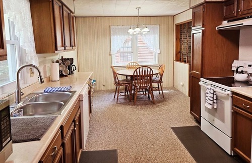 Kalkaska Cottage | New! Forrest’s Cabin - Lakefront with Sunset Views and Private Dock!