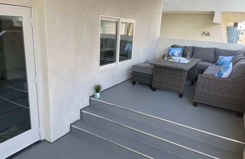 The Strand House | New ocean front duplex, walk to dining, shops & entertainment.