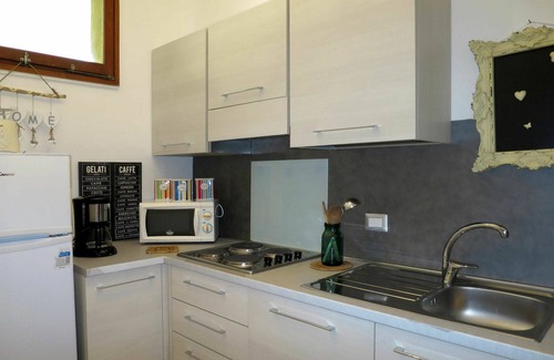 Brezzo di Bedero Apartment | Nice apartment for 4 guests with pool, WIFI, TV, patio, pets allowed and parking