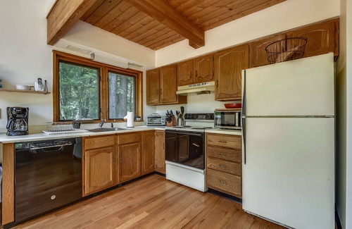 West Bridgewater Ski Chalet | Northeast Passage Chalet is a cozy and warm. Wonderful hot tub on the deck and a great big stone fireplace.
