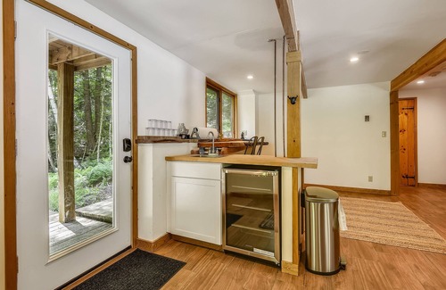 West Bridgewater Ski Chalet | Northeast Passage Chalet is a cozy and warm. Wonderful hot tub on the deck and a great big stone fireplace.