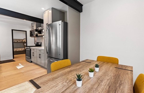 Boulder Bay House | Nostalgic vibe with modern amenities in midcentury log cabin with hot tub + more