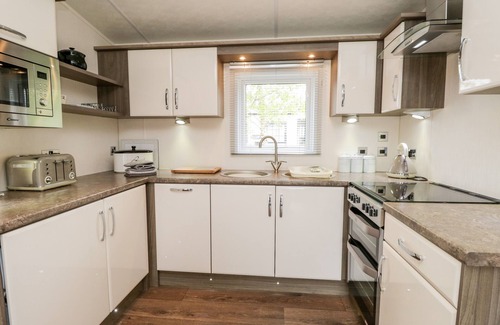 South Lakeland Leisure Village Cottage | NUMBER 10, pet friendly, country holiday cottage, with pool in Warton