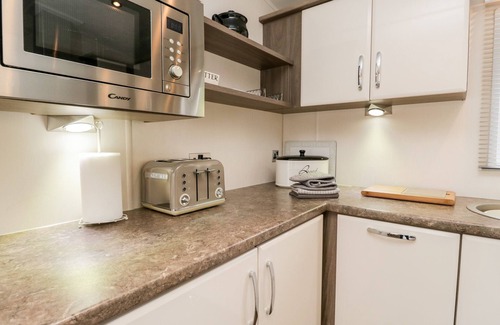 South Lakeland Leisure Village Cottage | NUMBER 10, pet friendly, country holiday cottage, with pool in Warton