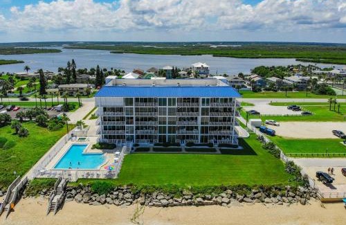 Bethune Beach Apartment | Ocean Condo 104 ~ Ground Floor Corner Condo with wrap around balcony Walk right out to Pool