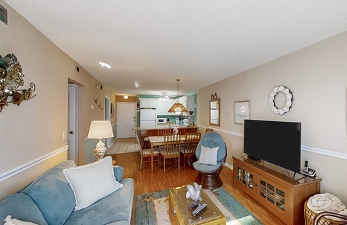 Crescent Beach Condo | Ocean-view condo near beach and golf with pool, balcony, central AC, & W/D