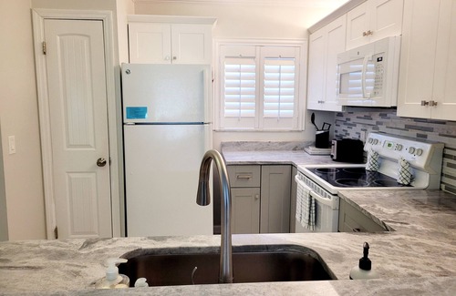 Crescent Beach Condo | Ocean view (pool side) 2 bedroom, 2 bath flat. Corner unit.