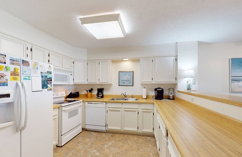 Rodanthe Condo | Oceanfront condo with outdoor pool, W/D BBQ, and balcony