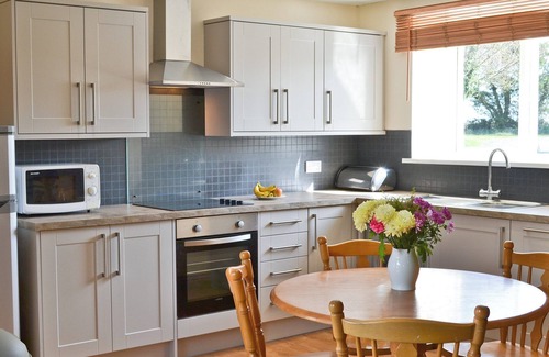 Warenford Cottage | One of five holiday homes with swimming pool, gym and tennis courts on site.