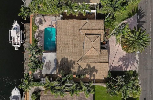 Garden Isles House | Palm Villa: New Remodel/Waterfront/Salt Water Pool!