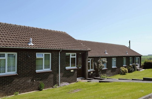 Embleton Cottage | Part of a small terrace of bungalows with uninterrupted views towards the sea.