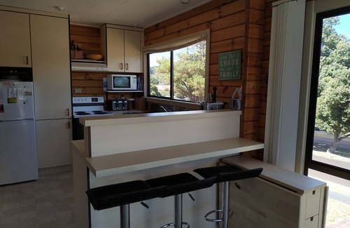 Pauanui House | Pauanui bach with great outdoor living and views.