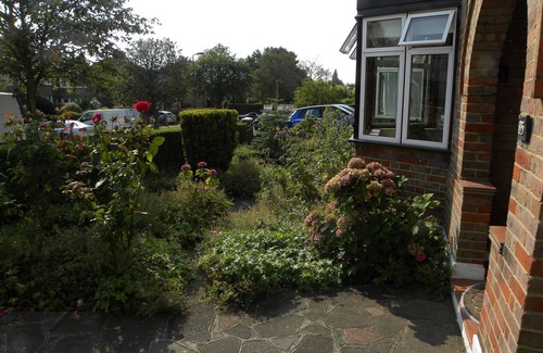 Harrow Weald House | Pets welcome at family home with piano and lovely garden with parking for two.