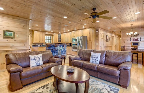 McCaysville Cabin | Pond-front cabin with private hot tub, fireplaces, furnished deck, & game room