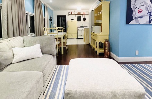 Baldwin Harbor Apartment | Poolside play with a relaxing hot tub, fire pit, & gazebo with a television.