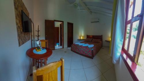 Cumuruxatiba Hotel | Pousada É