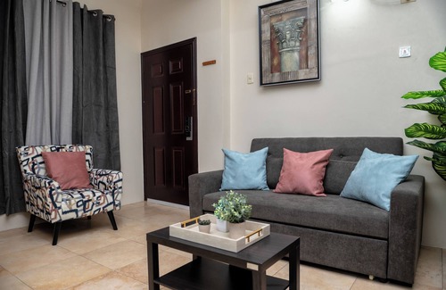 Newtown Apartment | Prime Location + Rooftop Access + City Views + Queens Park Savannah + Walkable