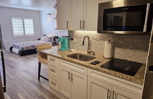 Southwest Orlando Condo | Prime Resort Studio near Universal & Disney balcony with LAKE VIEW