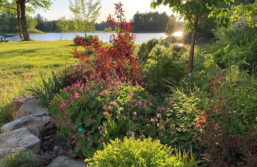 Clare Ski Chalet | Private cottage on 8 wooded and flower-filled acres at Lake Wentworth and the Wentworth River