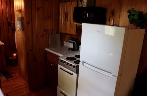 Presque Isle Cottage | Private log cabin with view overlooking Grand Lake