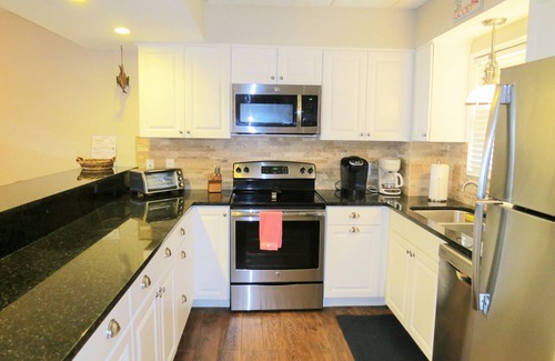 Fernandina Beach Condo | Private PIER Ground Floor Oceanfront Condo with King Bed, Tennis Courts & Pool!