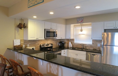 Fernandina Beach Condo | Private PIER Ground Floor Oceanfront Condo with King Bed, Tennis Courts & Pool!