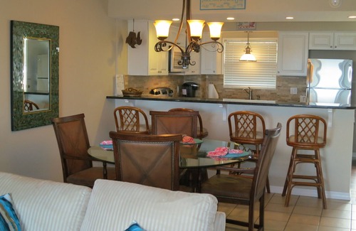 Fernandina Beach Condo | Private PIER Ground Floor Oceanfront Condo with King Bed, Tennis Courts & Pool!