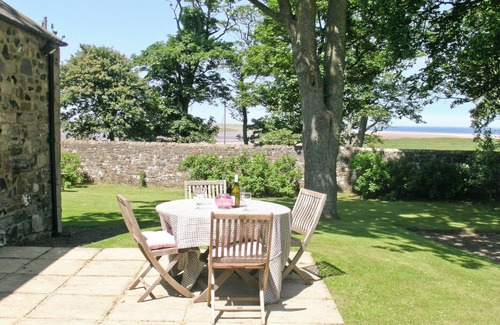 Bamburgh Cottage | Quality accommodation which boasts views across Budle Bay and Holy Island.