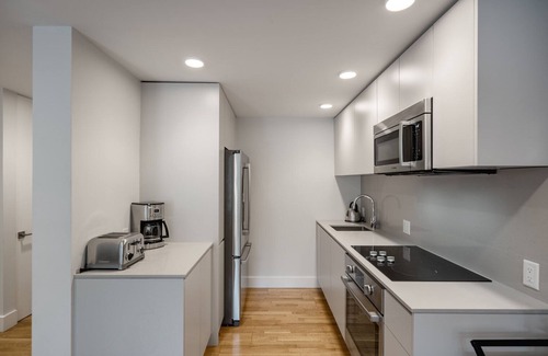 Mid-Cambridge Apartment | Rad Harvard Sq 1BR w/Balcony, near Shops & Campus, by Blueground