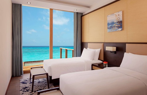 Huruelhi Island Resort | Radisson Blu Resort Maldives with 50 % off on Sea Plane round trip 03 nights & above