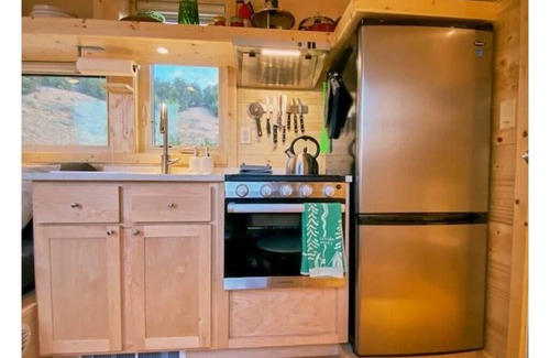 Arroyo Hondo House | Rainbow Tiny Home w Mountain View, Hot Tub, and Hot Springs just 2 miles away.