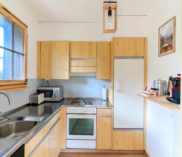 Villars-sur-Ollon Apartment | Rare, quite & centered Apartment with Garden & Fireplace