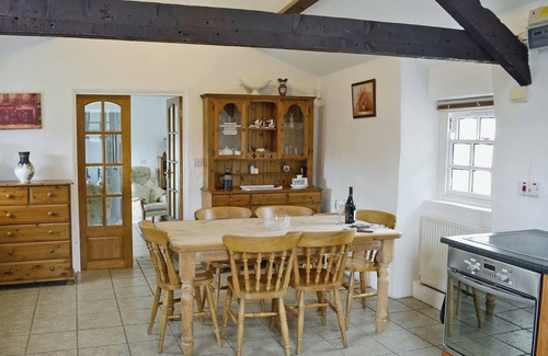 Garn Fadryn Cottage | Relax and unwind in the blissful, private hot tub.