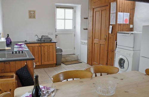 Garn Fadryn Cottage | Relax and unwind in the blissful, private hot tub.