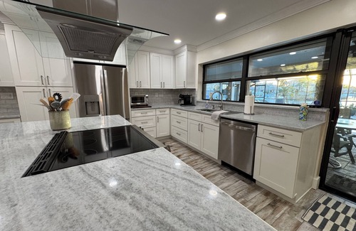 Island Estate House | RELAXING CAGED POOL WATERFRONT PRIVATE 1 STORY 4/3 DOCK LRG MASTER - RENOVATED
