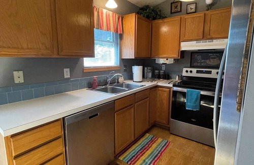 Wichita House | Relaxing Getaway with Outdoor Patio, Fire Pit, and Pool Table