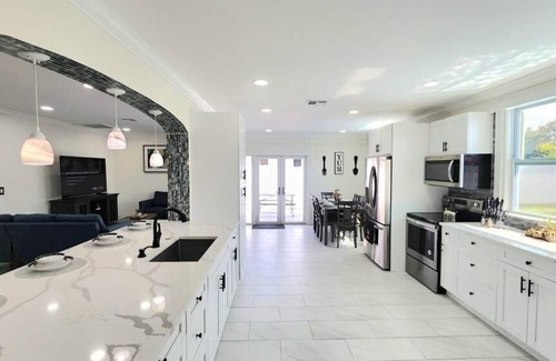 Royal Palm Beach House | Remodeled cozy family house with heated pool, 10 min from the airport!