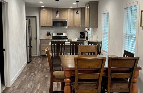 Edgerton House | Remodeled home with pontoon rental 2 decks Private beach playground volleyball