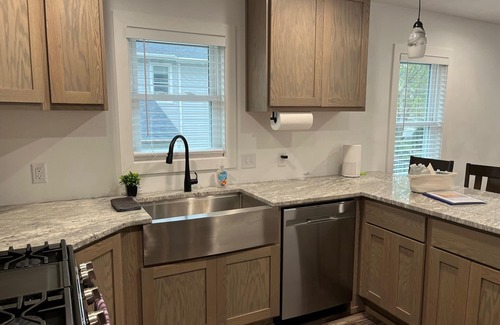 Edgerton House | Remodeled home with pontoon rental 2 decks Private beach playground volleyball