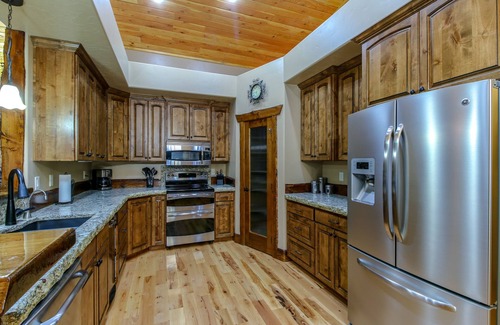 Tamarack Resort Cabin | REMOTE CABIN WITH HOT TUB, MOVIE THEATER AND HUGE COVERED DECK WITH FIRE TABLE