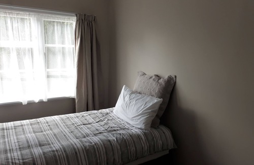 Otaki House | Renovated house set amongst mature trees