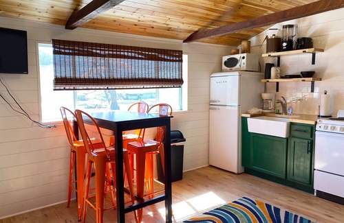 Camdenton Cabin | Renovated lakeside cabin with pool & resort amenities!