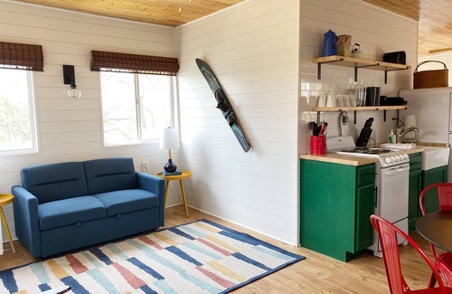 Camdenton Cabin | Renovated lakeside cabin with swimming pool & resort amenities!