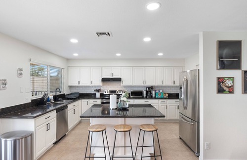 Chandler House | Resort style home Pampa Oasis with heated hot tub, pool, and billiards
